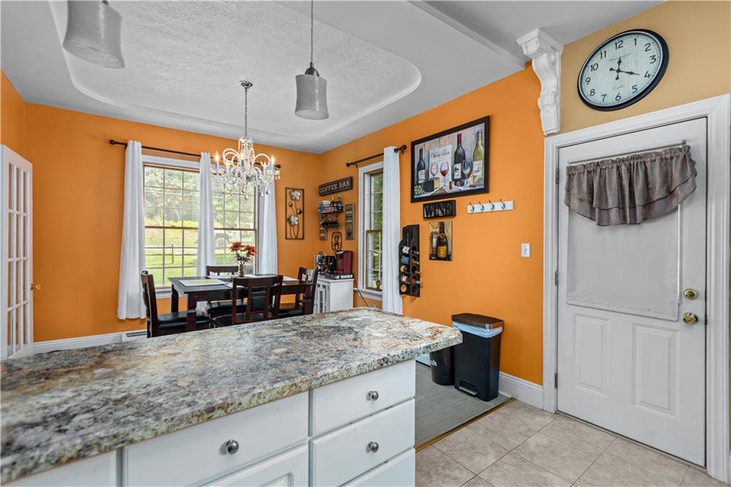 1701 Darlington Road Beaver Falls, PA 15010 - Photo 13 of 30 a kitchen with stainless steel appliances granite countertop a stove and a refrigerator