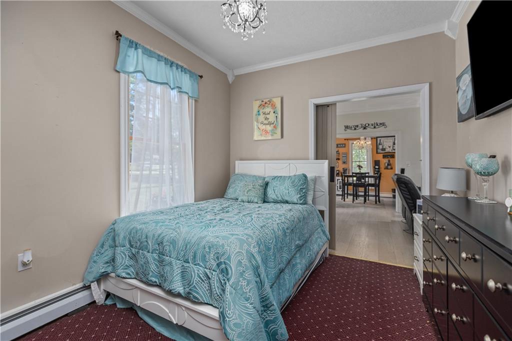 1701 Darlington Road Beaver Falls, PA 15010 - Photo 15 of 30 a bed room with a bed and a television