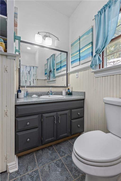 1701 Darlington Road Beaver Falls, PA 15010 - Photo 19 of 30 a bathroom with a granite countertop sink a toilet and a mirror