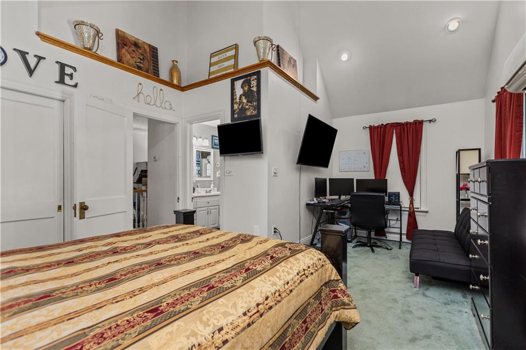 1701 Darlington Road Beaver Falls, PA 15010 - Photo 23 of 30 a bedroom with a bed and a flat screen tv