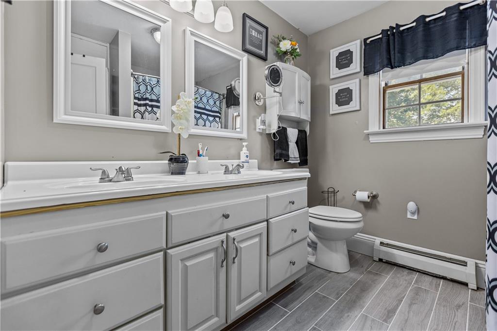 1701 Darlington Road Beaver Falls, PA 15010 - Photo 24 of 30 a spacious bathroom with double sink a toilet and a window