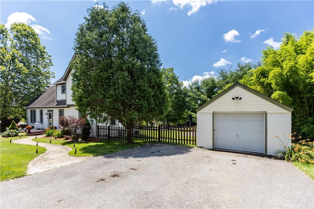 1701 Darlington Road Beaver Falls, PA 15010 - Photo 3 of 30 a front view of a house with a yard and garage