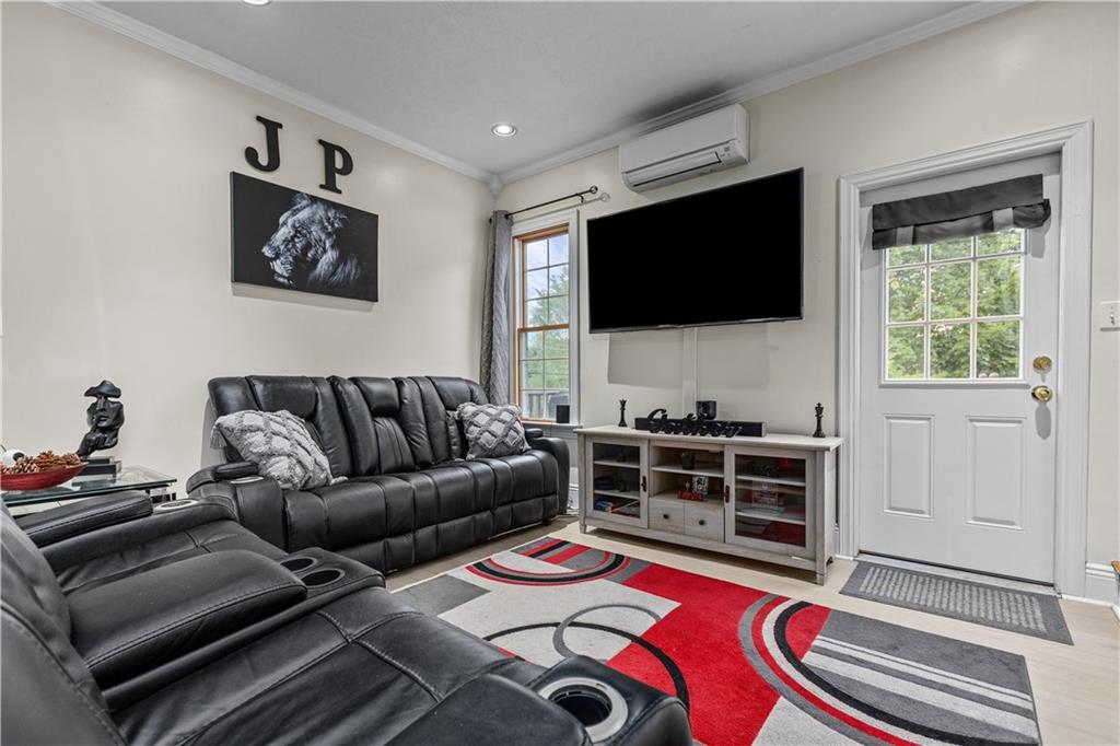 1701 Darlington Road Beaver Falls, PA 15010 - Photo 7 of 30 a living room with furniture and a flat screen tv