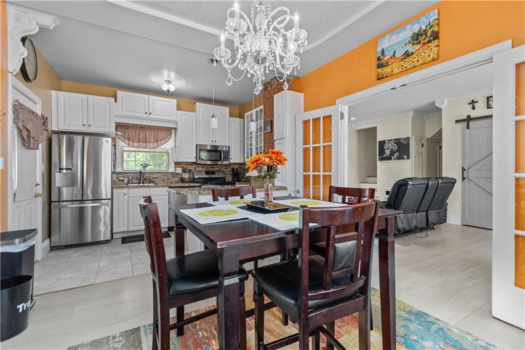 1701 Darlington Road Beaver Falls, PA 15010 - Photo 10 of 30 a view of a dining room with furniture