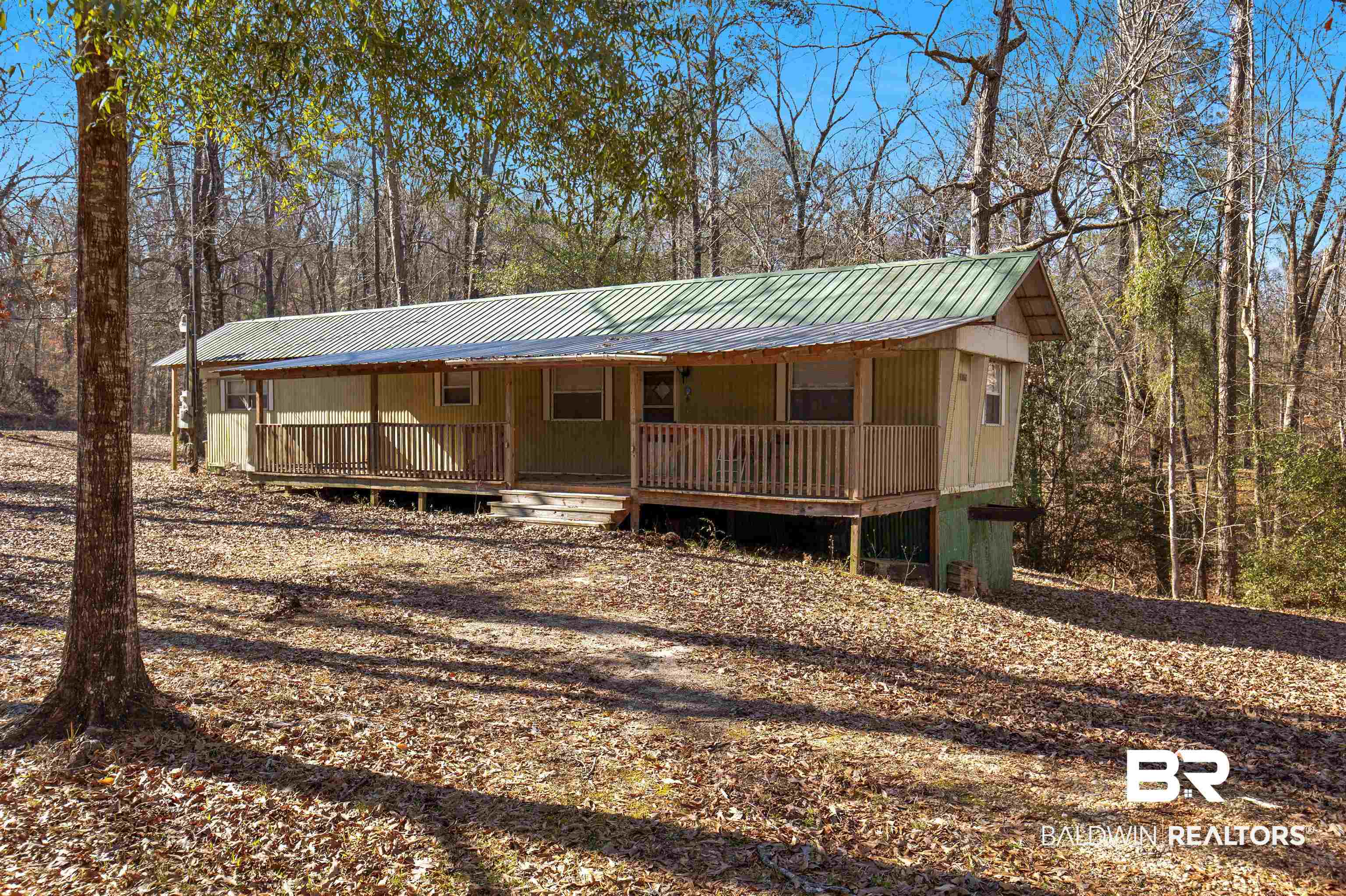 17 Pine Court Camden, AL 36726 - Photo 2 of 32 View of front of house featuring a porch and metal roof