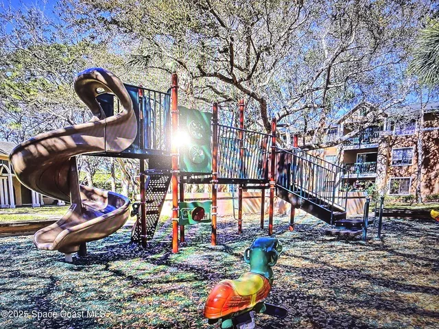 a view of a park with large trees