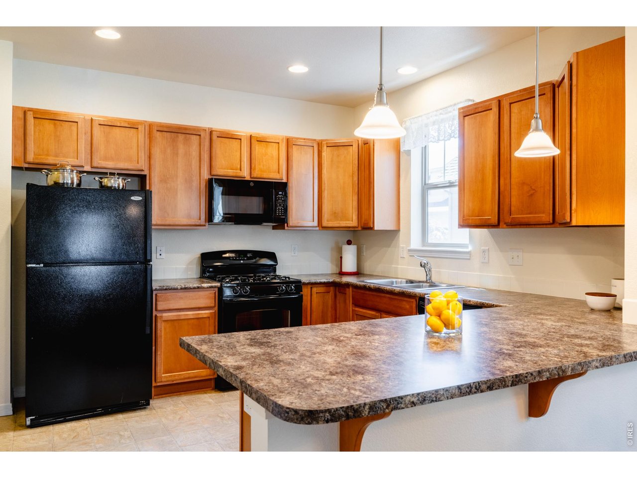 1422 Haystack Way Lafayette, CO 80026 - Photo 10 of 33 Spacious kitchen allows for plenty of work space, along with a seat at the counter.
