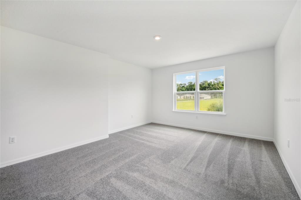 1873 Shadow Box Bend St. Cloud, FL 34771 - Photo 13 of 27 an empty room with a window