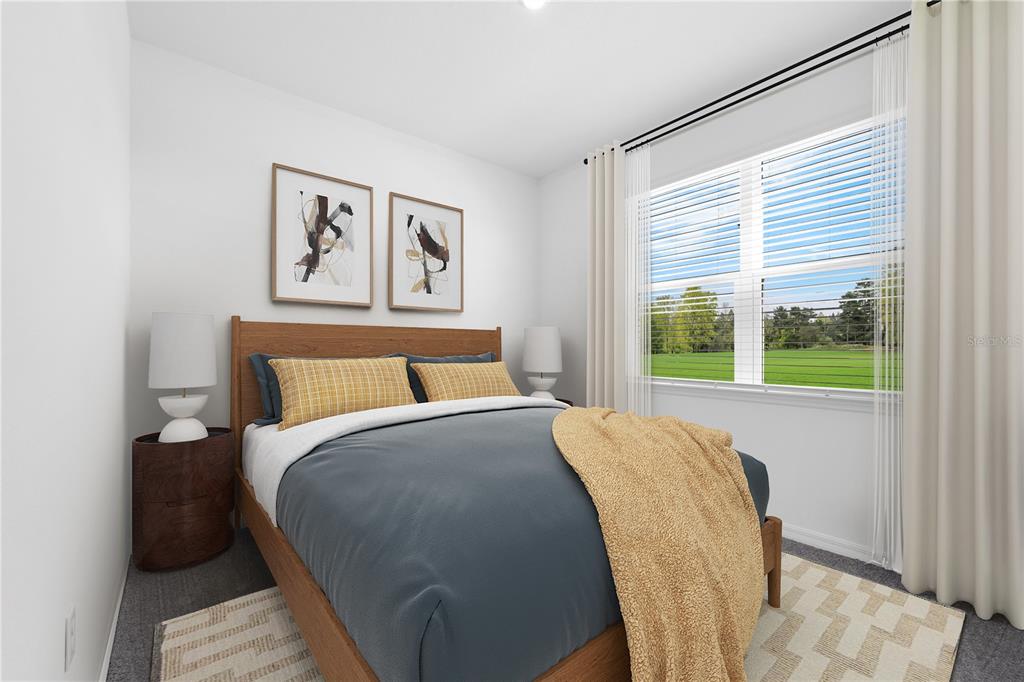 1873 Shadow Box Bend St. Cloud, FL 34771 - Photo 17 of 27 a bedroom with a bed and a large window