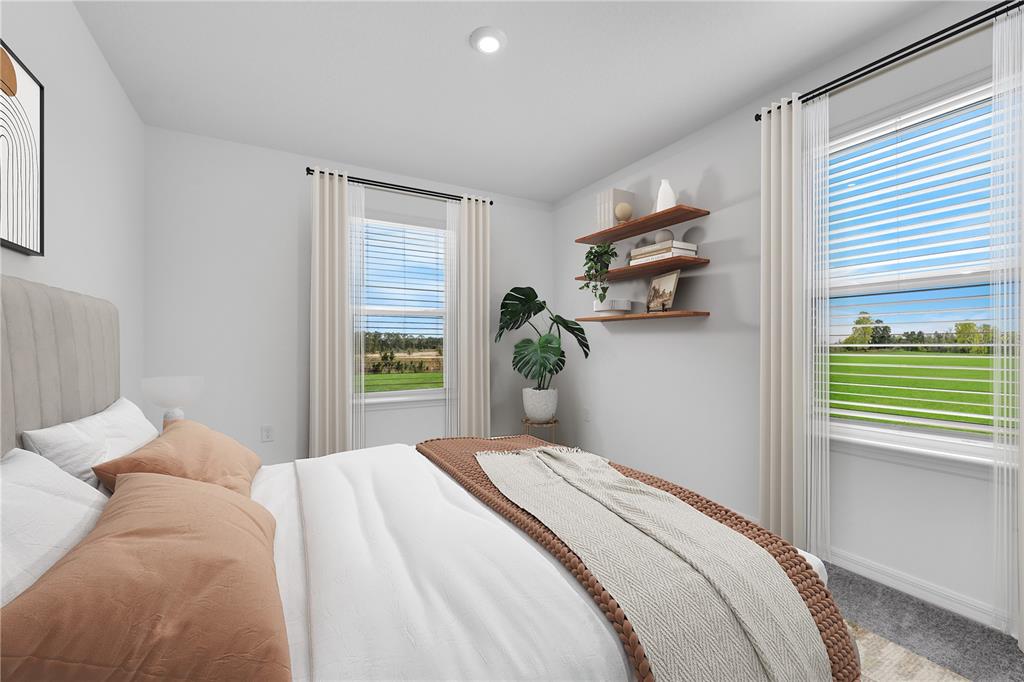 1873 Shadow Box Bend St. Cloud, FL 34771 - Photo 18 of 27 a bedroom with a bed and a window