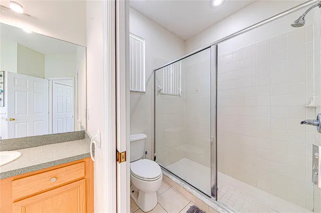 a bedroom with a bed and flat screen tv