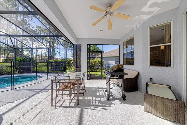 a view of a swimming pool with a patio