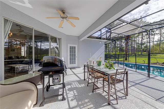 a view of a hallway to kitchen with wooden floor