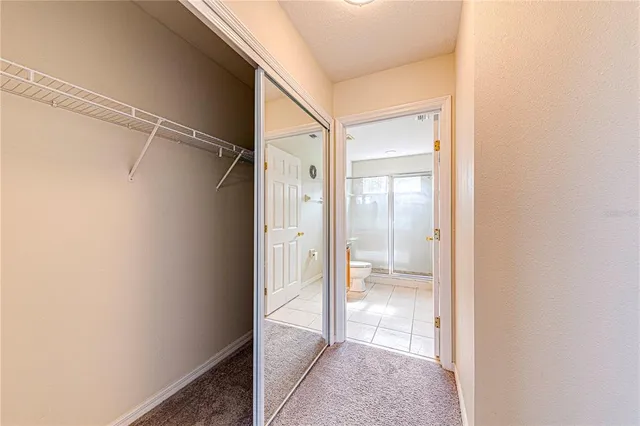 an aerial view of a house with a garden and trees