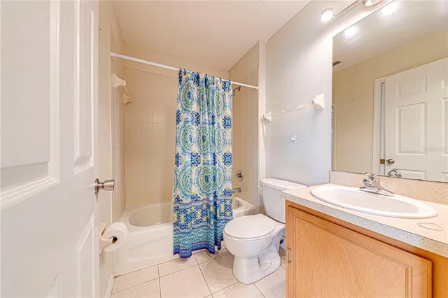 an aerial view of residential houses with outdoor space and swimming pool