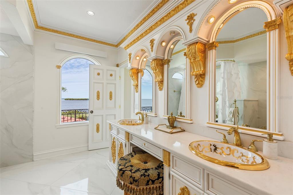 2115 Alexis Court Tarpon Springs, FL 34689 - Photo 36 of 100 a bathroom with a granite countertop sink and a mirror