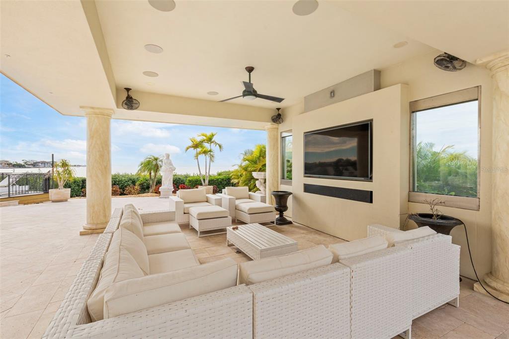 2115 Alexis Court Tarpon Springs, FL 34689 - Photo 51 of 100 a living room with furniture large window and flat screen tv