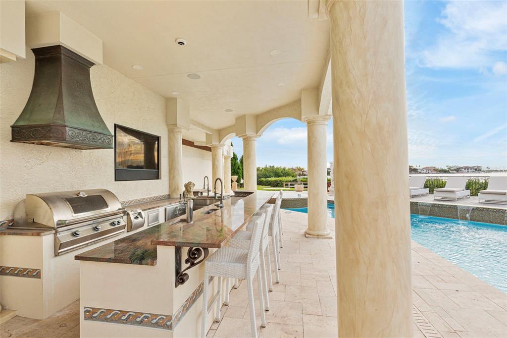 2115 Alexis Court Tarpon Springs, FL 34689 - Photo 52 of 100 a view of living room with furniture and flat screen tv