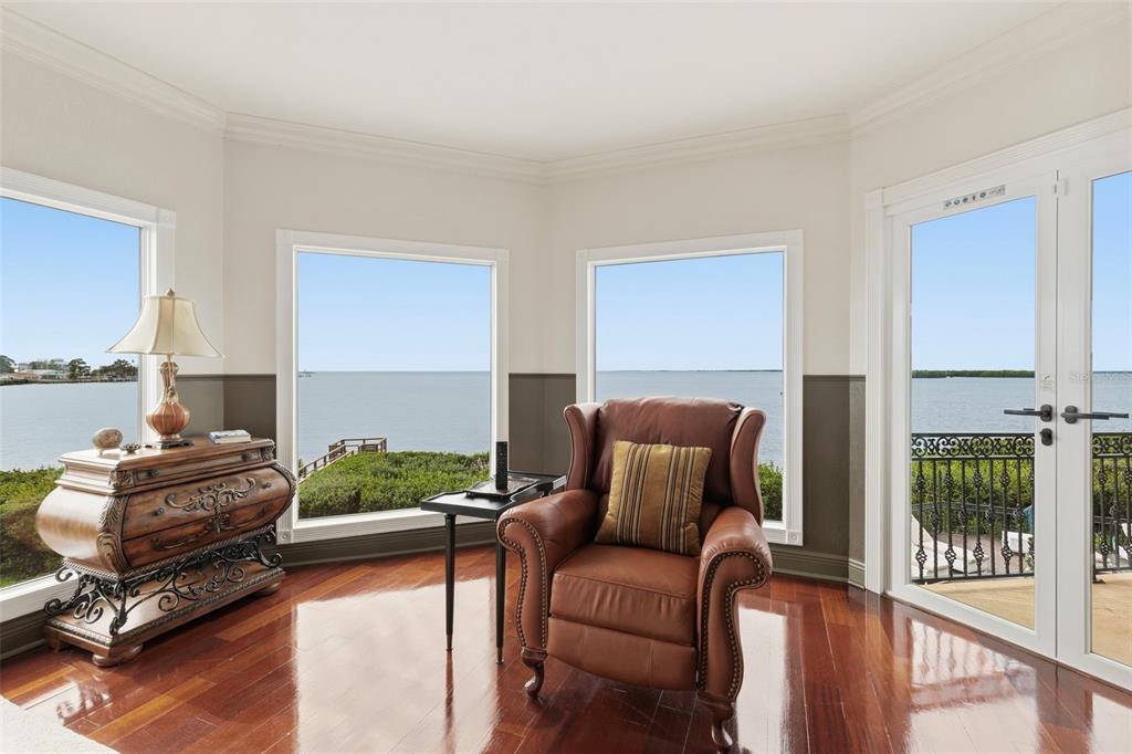 2115 Alexis Court Tarpon Springs, FL 34689 - Photo 67 of 100 a living room with furniture gym equipment and wooden floor