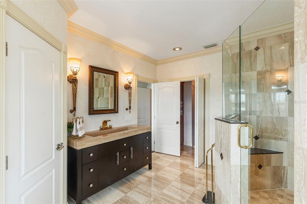 2115 Alexis Court Tarpon Springs, FL 34689 - Photo 77 of 100 a spacious bathroom with a double vanity sink mirror and shower