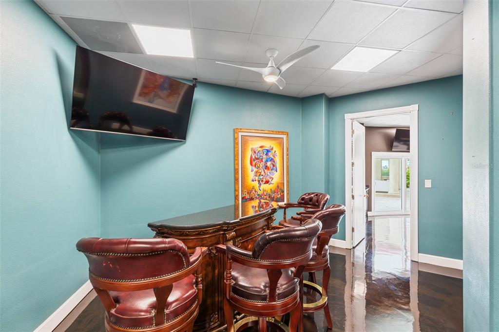 2115 Alexis Court Tarpon Springs, FL 34689 - Photo 86 of 100 a view of a dining room with furniture and wooden floor