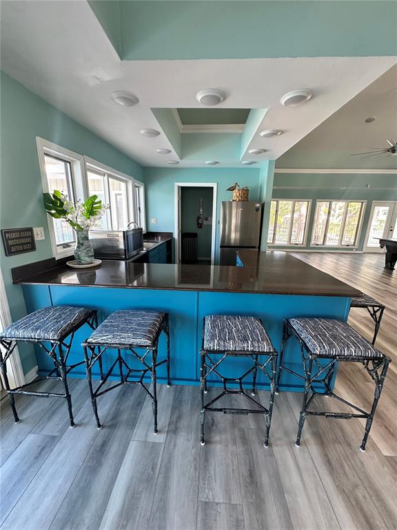 2115 Alexis Court Tarpon Springs, FL 34689 - Photo 97 of 100 a living room with furniture and a wooden floor