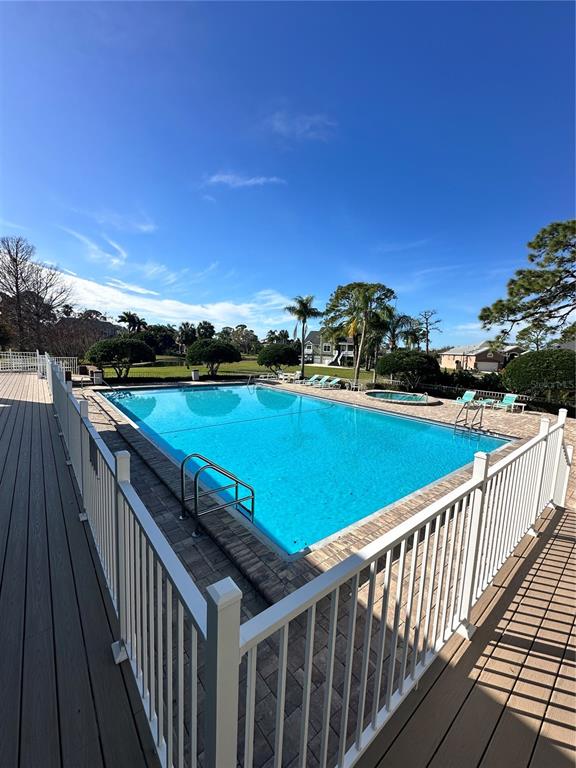 2115 Alexis Court Tarpon Springs, FL 34689 - Photo 99 of 100 a view of a balcony with wooden floor and city view