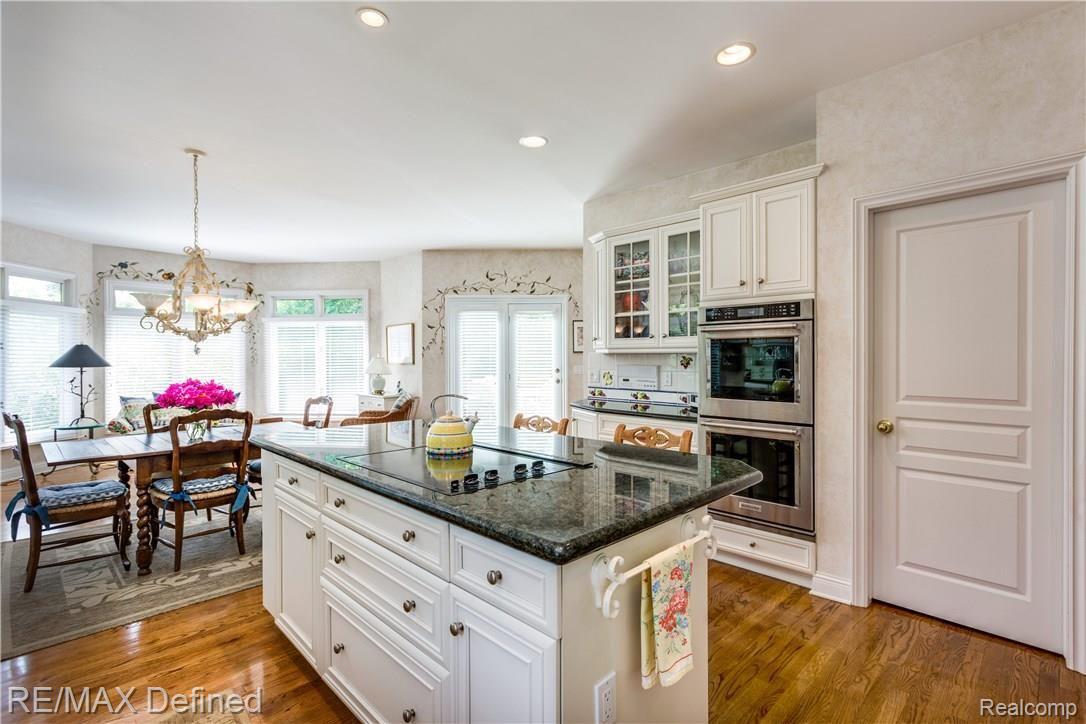 585 Whims Lane Rochester, MI 48306 - Photo 8 of 30 Gorgeous kitchen with spacious walk-in pantry and new double ovens. Open the oven, we dare you!