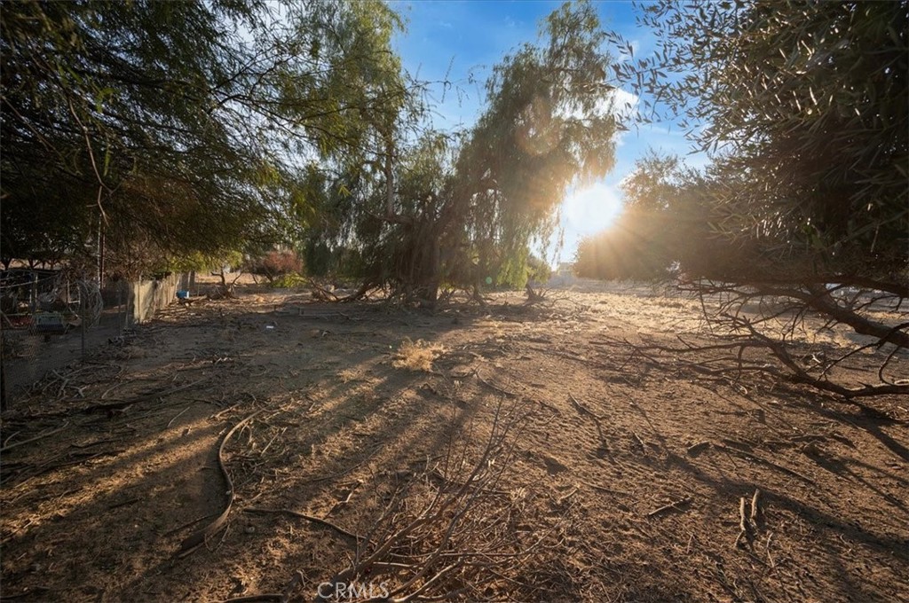 22600 Marquez Road Perris, CA 92570 - Photo 4 of 14 a backyard of a house with lots of green space
