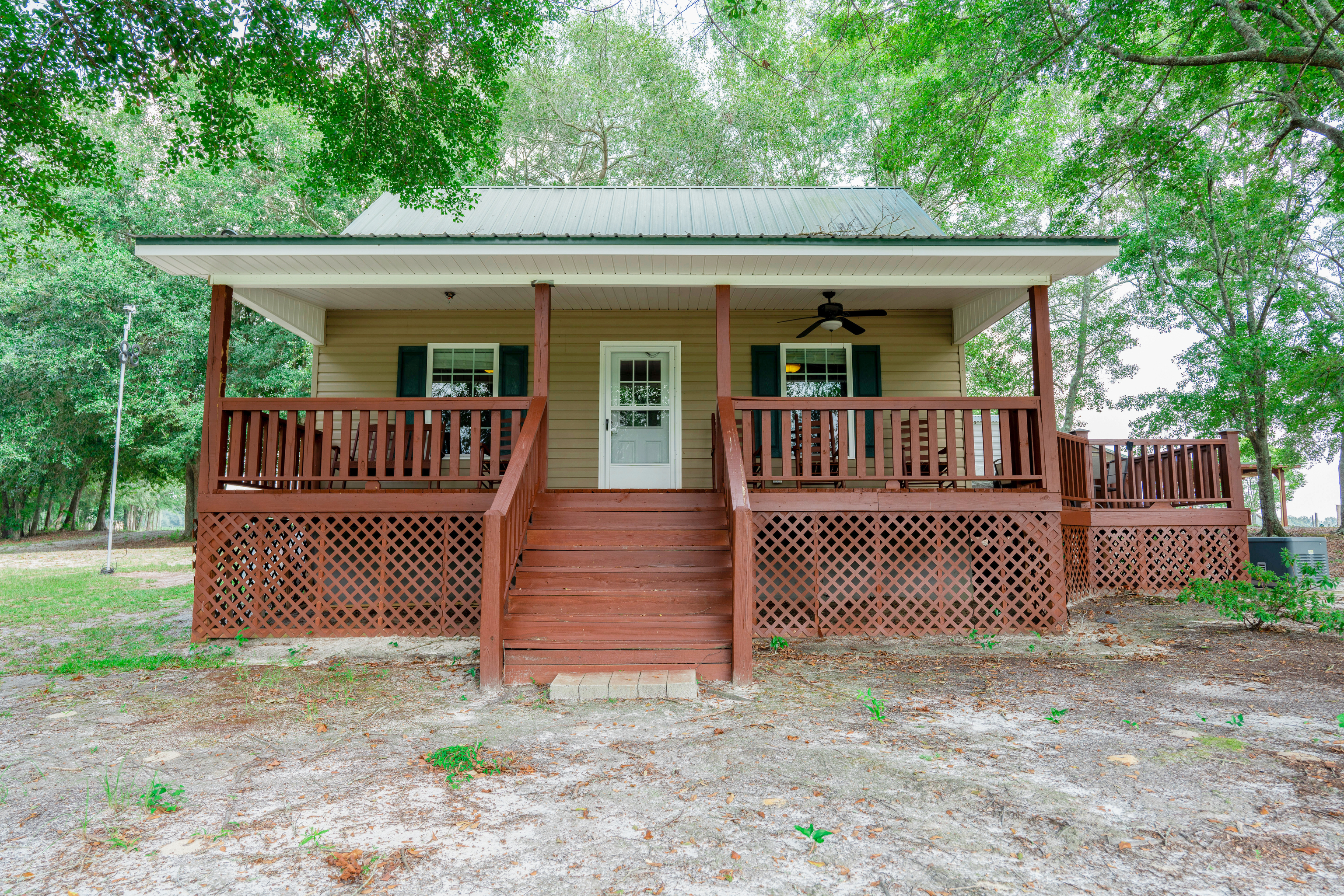 a front view of a house with iron fence