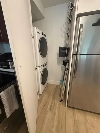 a view of storage and utility room with washer dryer