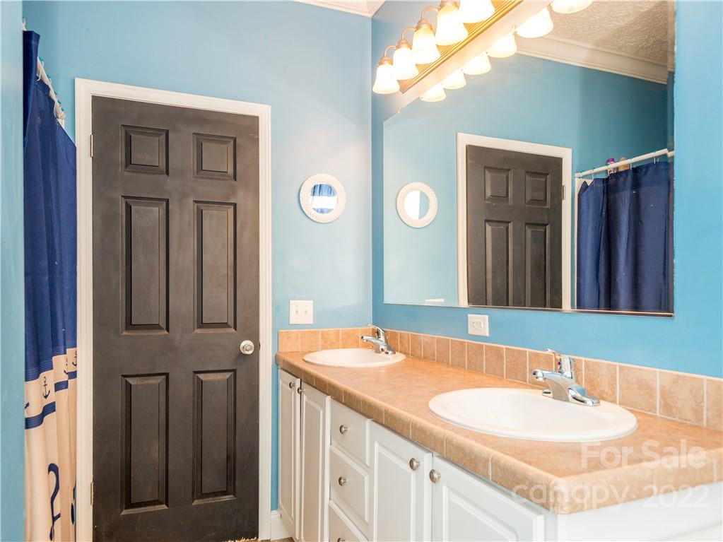 5308 Highway 64 Rutherfordton, NC 28139 - Photo 8 of 29 a bathroom with a sink and a mirror
