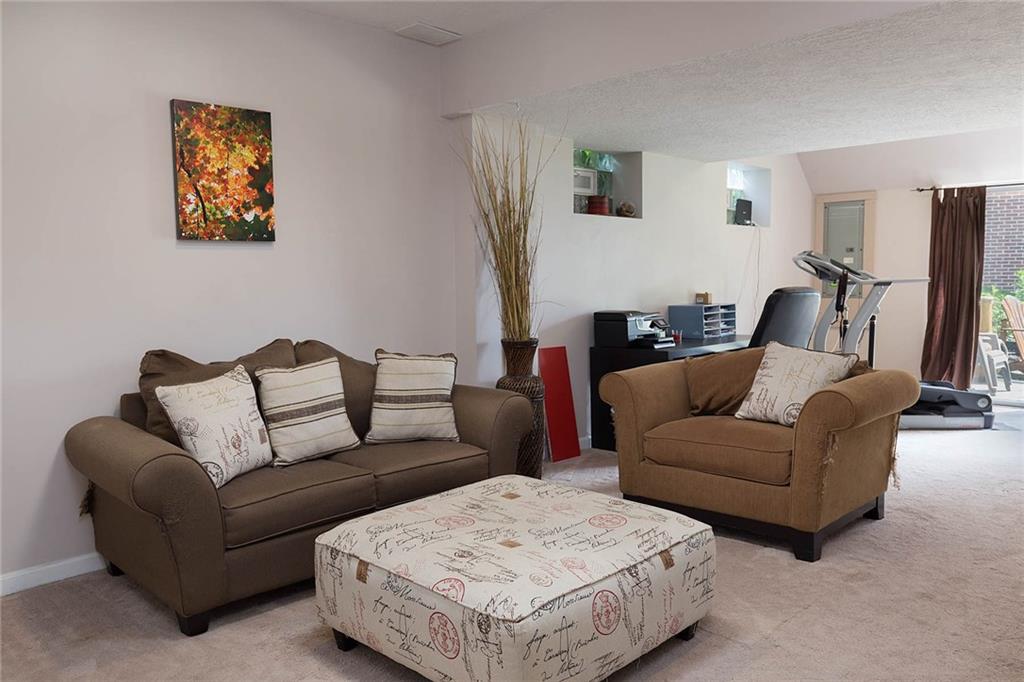501 Hidden Court McKees Rocks, PA 15136 - Photo 19 of 25 Finished basement is huge and currently utilized as den/workout/office space!