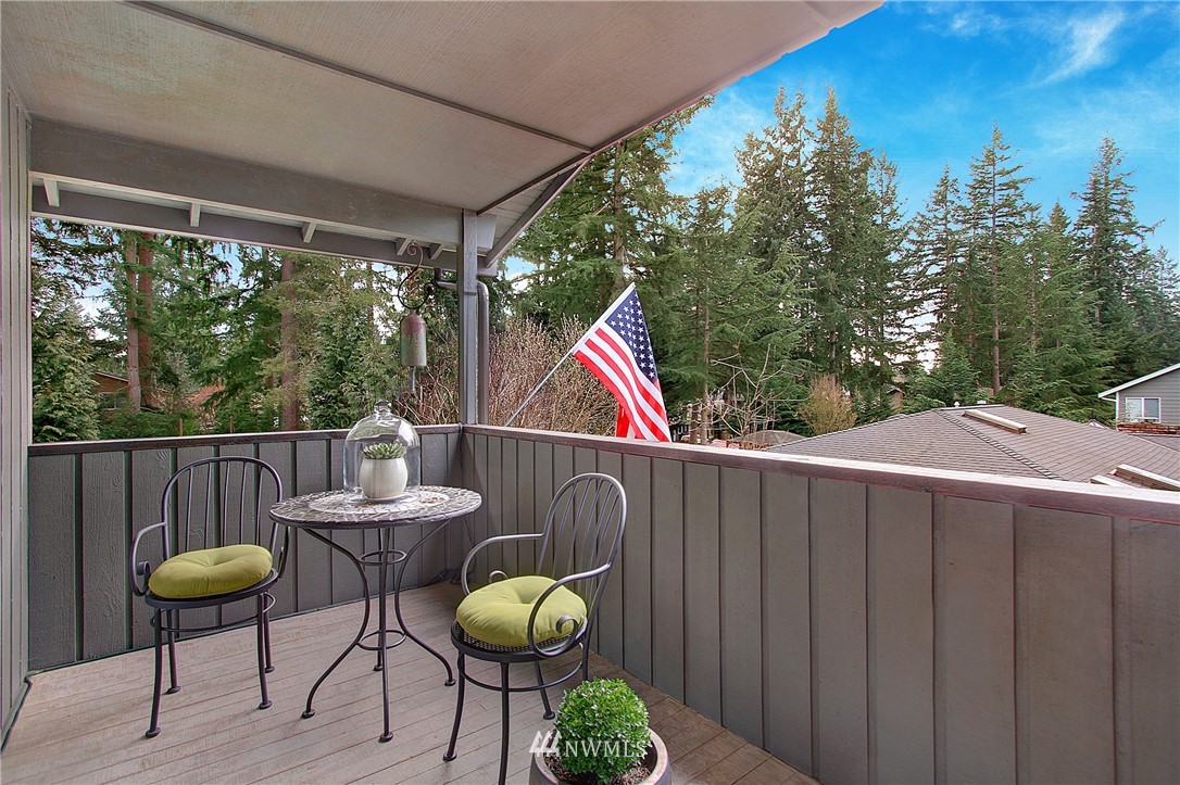 15003 Southeast 138th Place Renton, WA 98059 - Photo 11 of 38 a view of balcony with wooden floor and outdoor seating