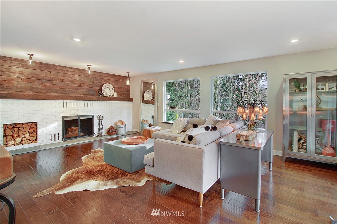 15003 Southeast 138th Place Renton, WA 98059 - Photo 13 of 38 a living room with furniture and a fireplace
