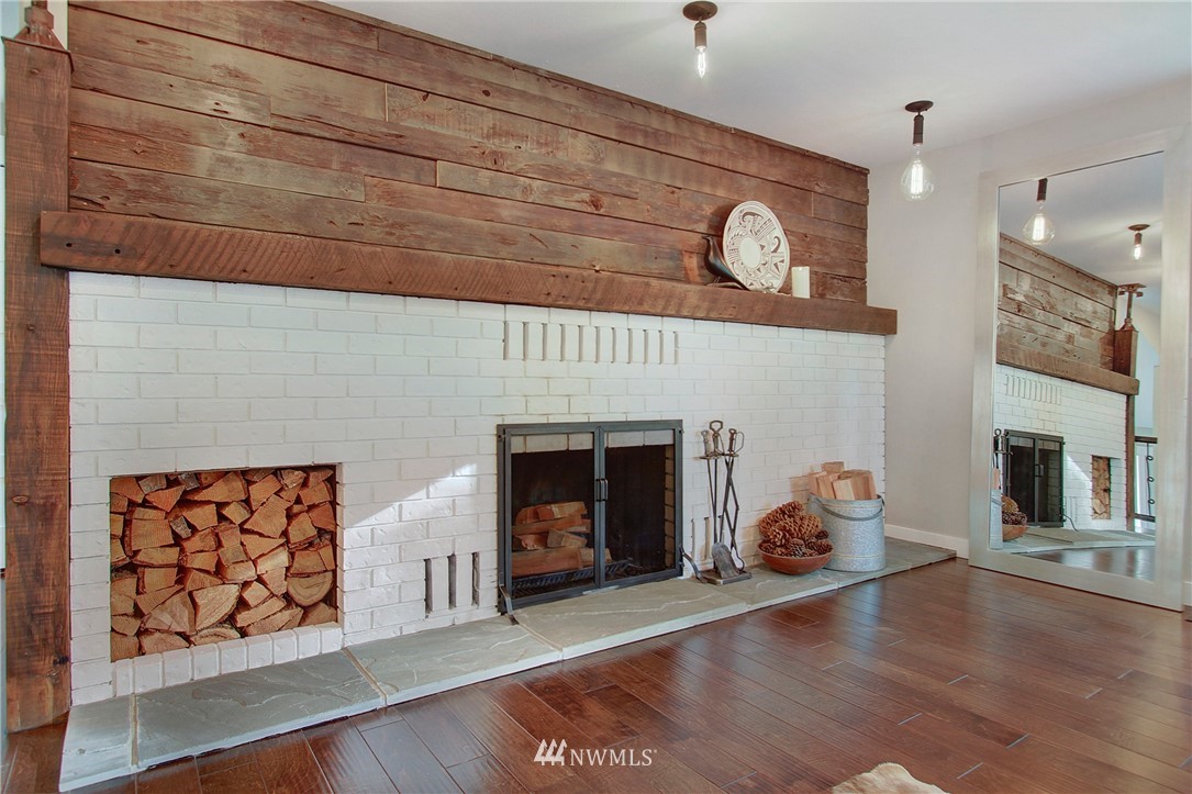 15003 Southeast 138th Place Renton, WA 98059 - Photo 14 of 38 a view of a livingroom with furniture and a fireplace
