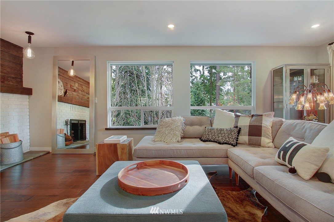 15003 Southeast 138th Place Renton, WA 98059 - Photo 15 of 38 a living room with fireplace furniture and a large window