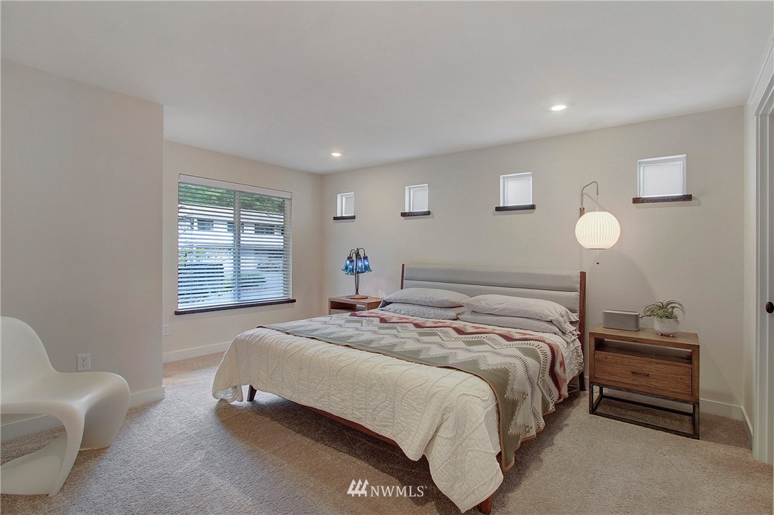 15003 Southeast 138th Place Renton, WA 98059 - Photo 18 of 38 a bedroom with a bed and a couch