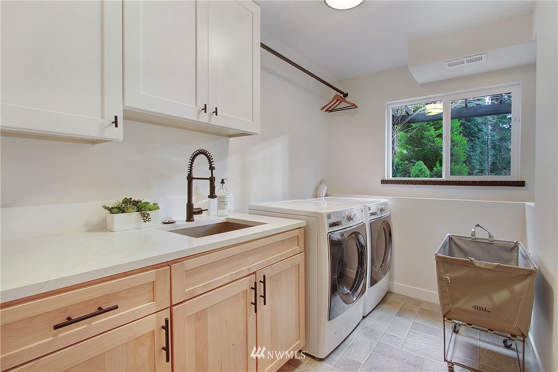 15003 Southeast 138th Place Renton, WA 98059 - Photo 25 of 38 a view with a sink and washer dryer
