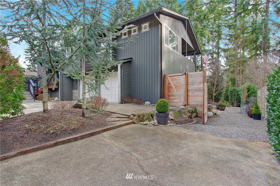 15003 Southeast 138th Place Renton, WA 98059 - Photo 28 of 38 a front view of a house with garden and tress