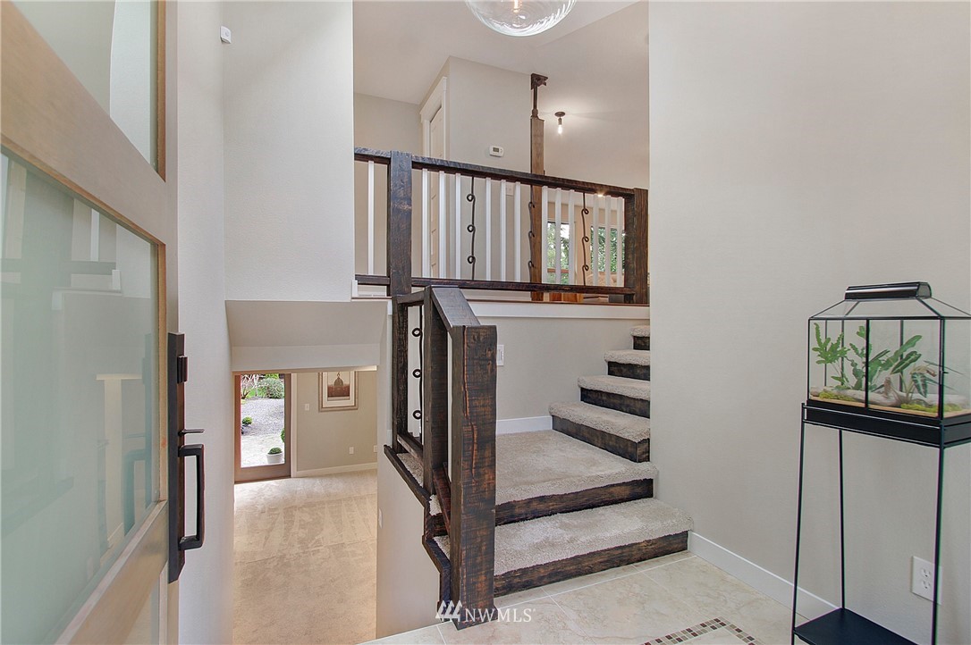 15003 Southeast 138th Place Renton, WA 98059 - Photo 3 of 38 a view of a hallway with windows