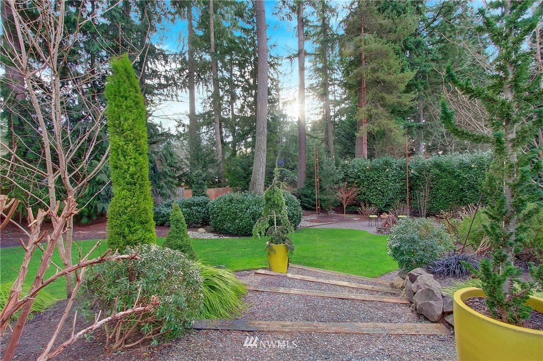 15003 Southeast 138th Place Renton, WA 98059 - Photo 32 of 38 a view of a garden with large trees