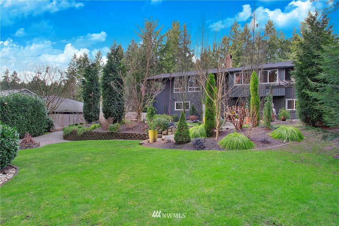 15003 Southeast 138th Place Renton, WA 98059 - Photo 33 of 38 a view of a house with a yard and potted plants