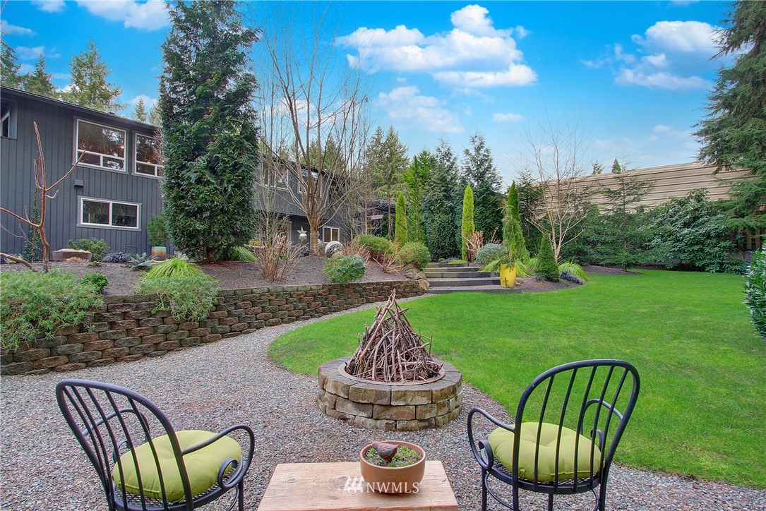 15003 Southeast 138th Place Renton, WA 98059 - Photo 35 of 38 a view of a patio with couches chairs and a yard