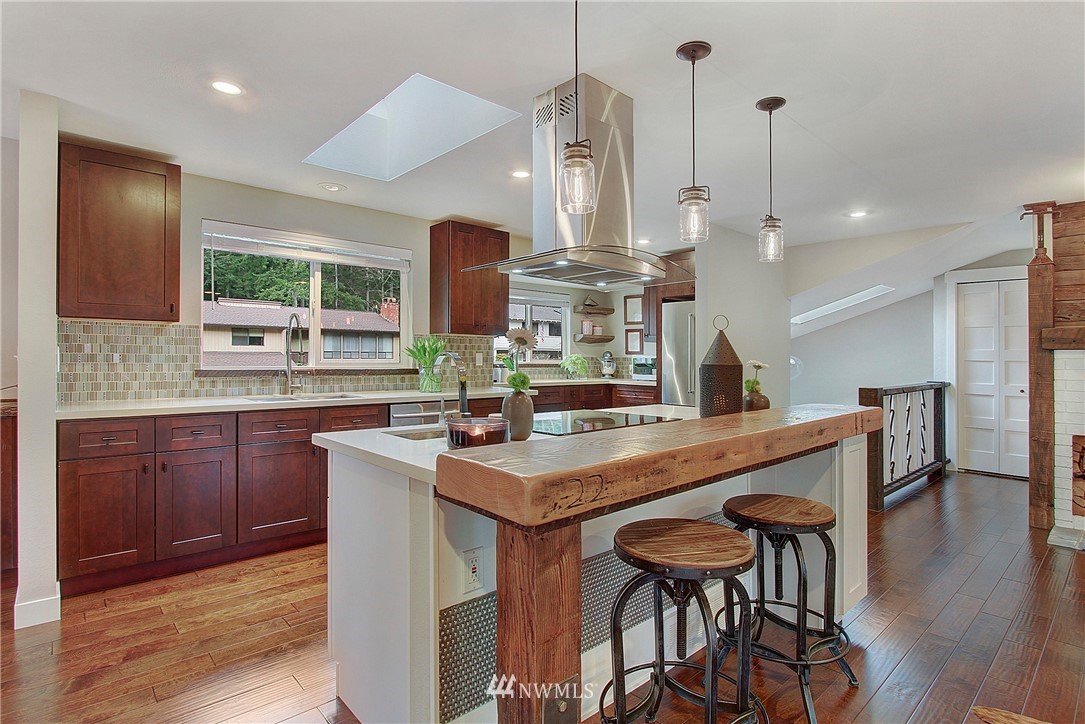 15003 Southeast 138th Place Renton, WA 98059 - Photo 4 of 38 a kitchen with a table and chairs in it