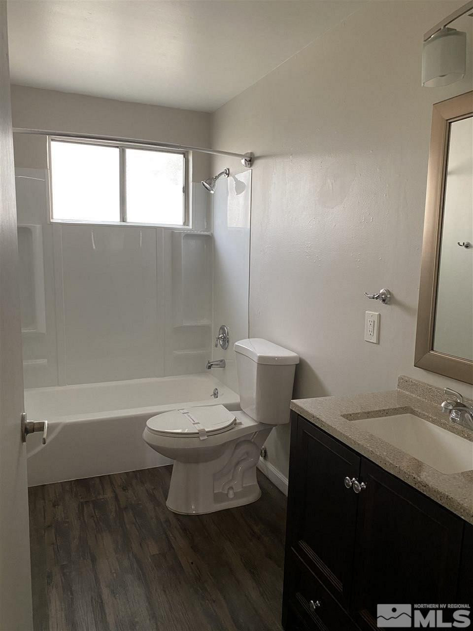 1365 Stardust Street, Unit 3 Reno, NV 89503 - Photo 7 of 9 a bathroom with a sink a toilet and shower