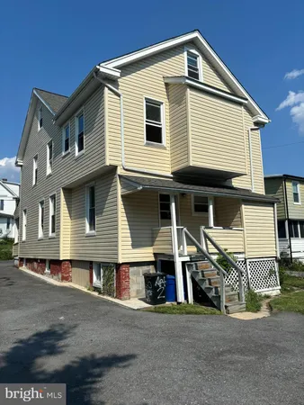 a front view of a house with a garage