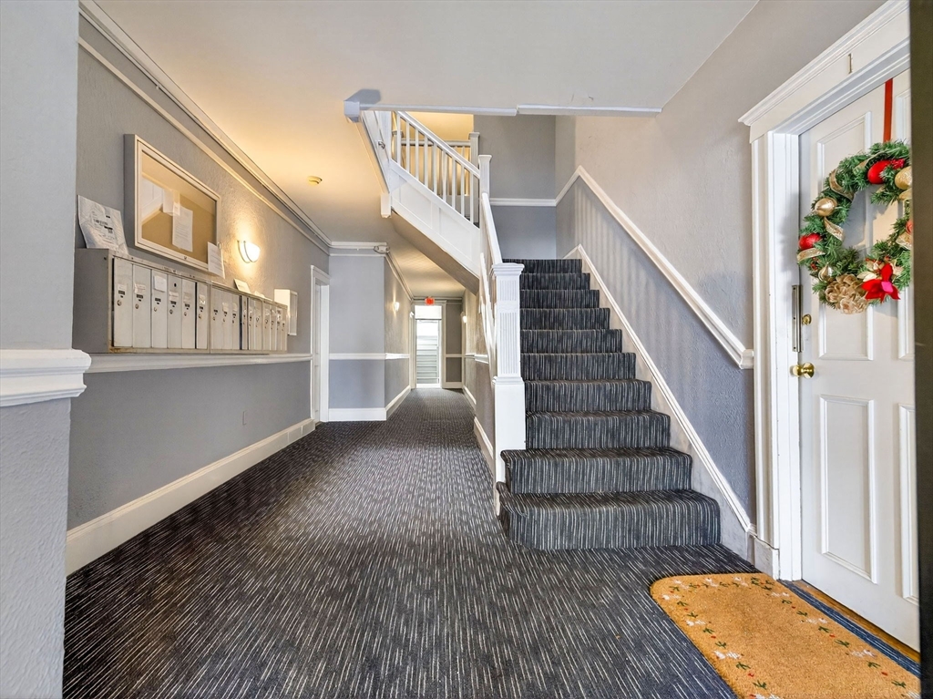 12 Ransom Road, Unit 7 Boston, MA 02135 - Photo 2 of 25 a view of entryway and hall with wooden floor