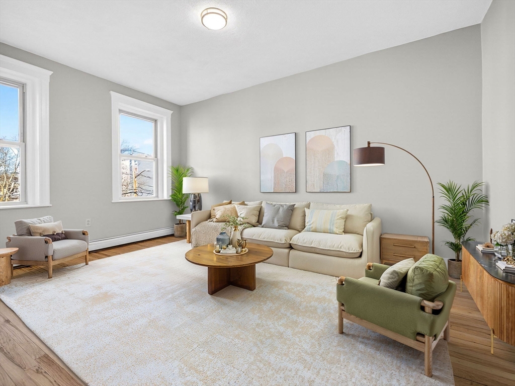 12 Ransom Road, Unit 7 Boston, MA 02135 - Photo 5 of 25 a living room with furniture and a potted plant
