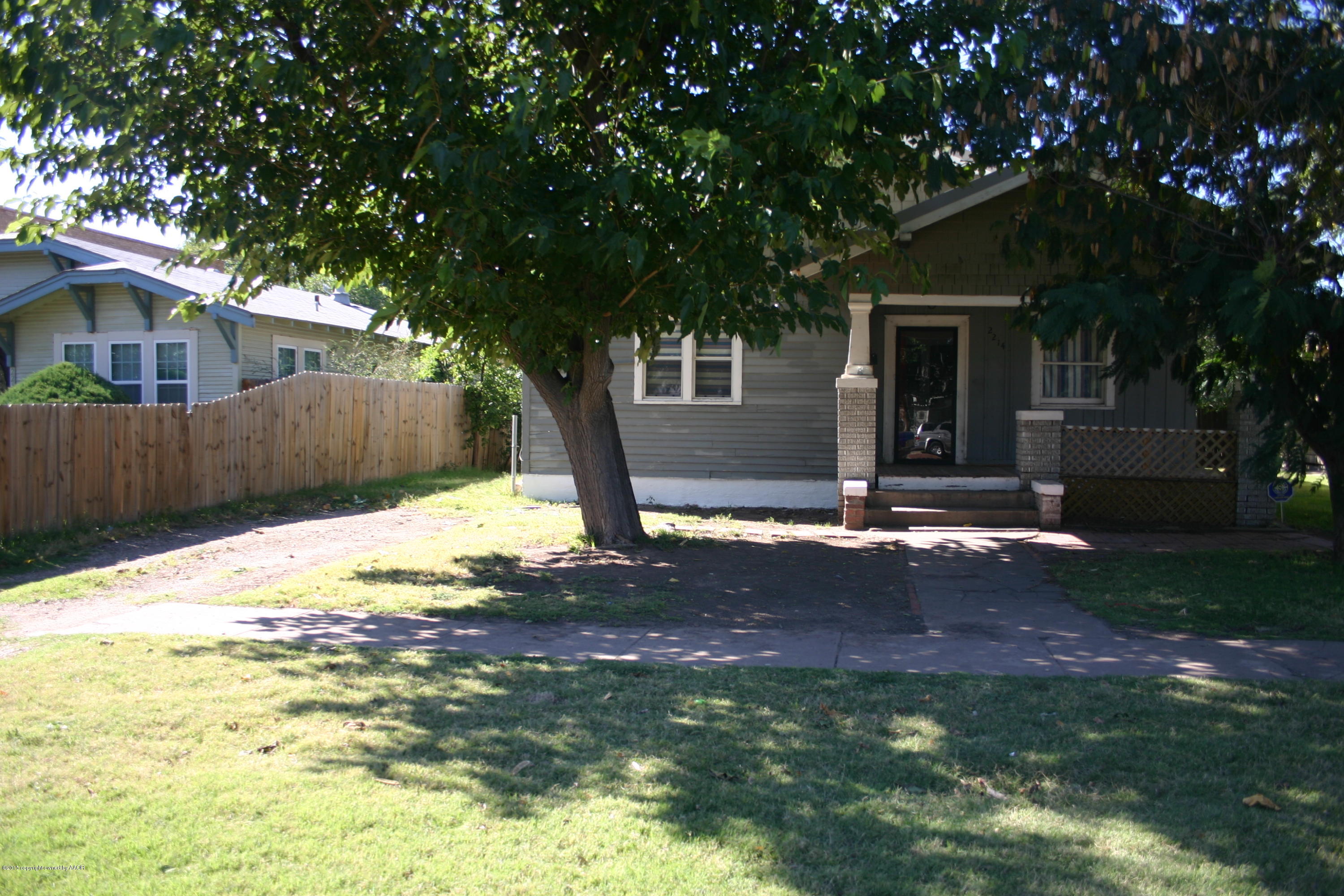 a house view with a backyard space